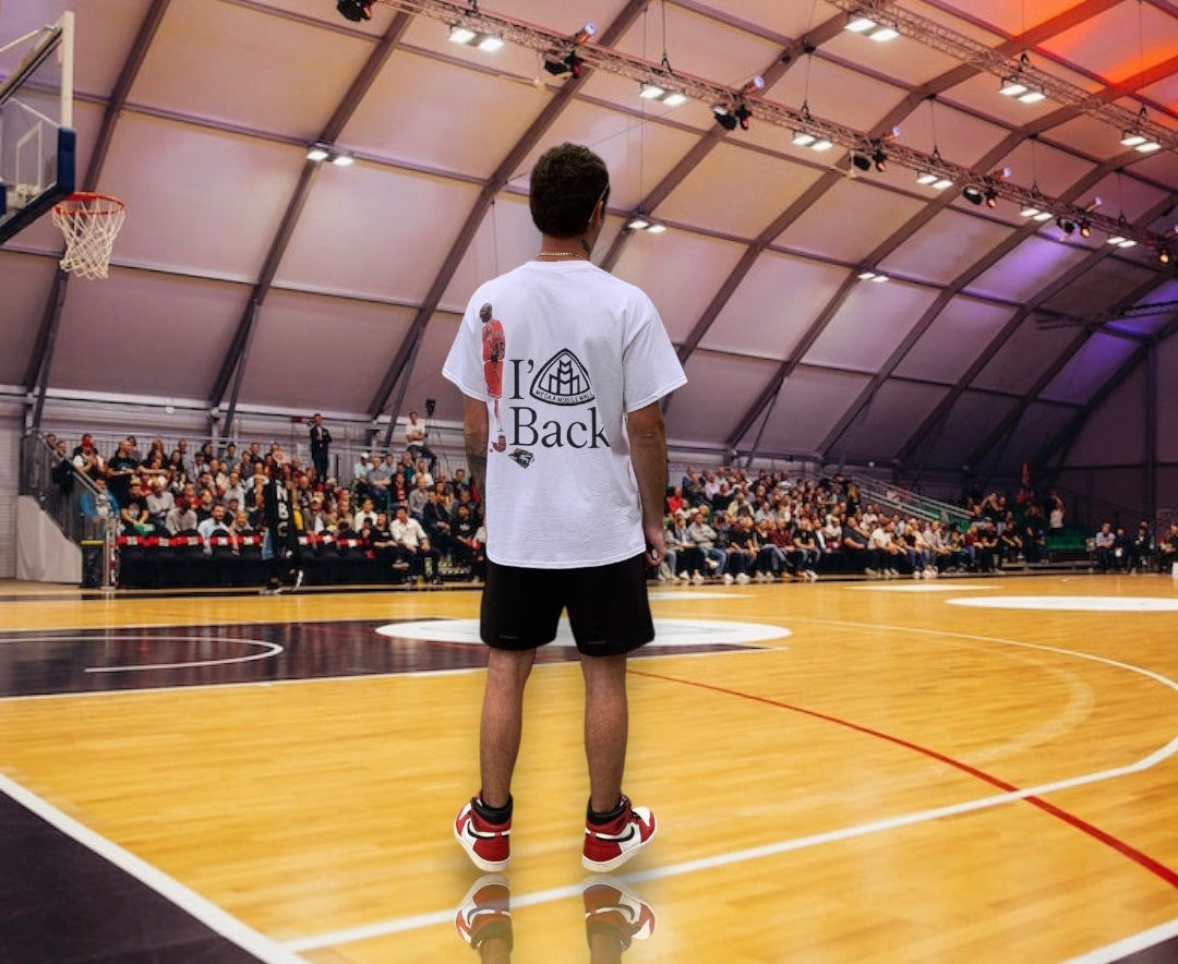 I'm Back Jordan Shirt on model wearing size large on a basketball court