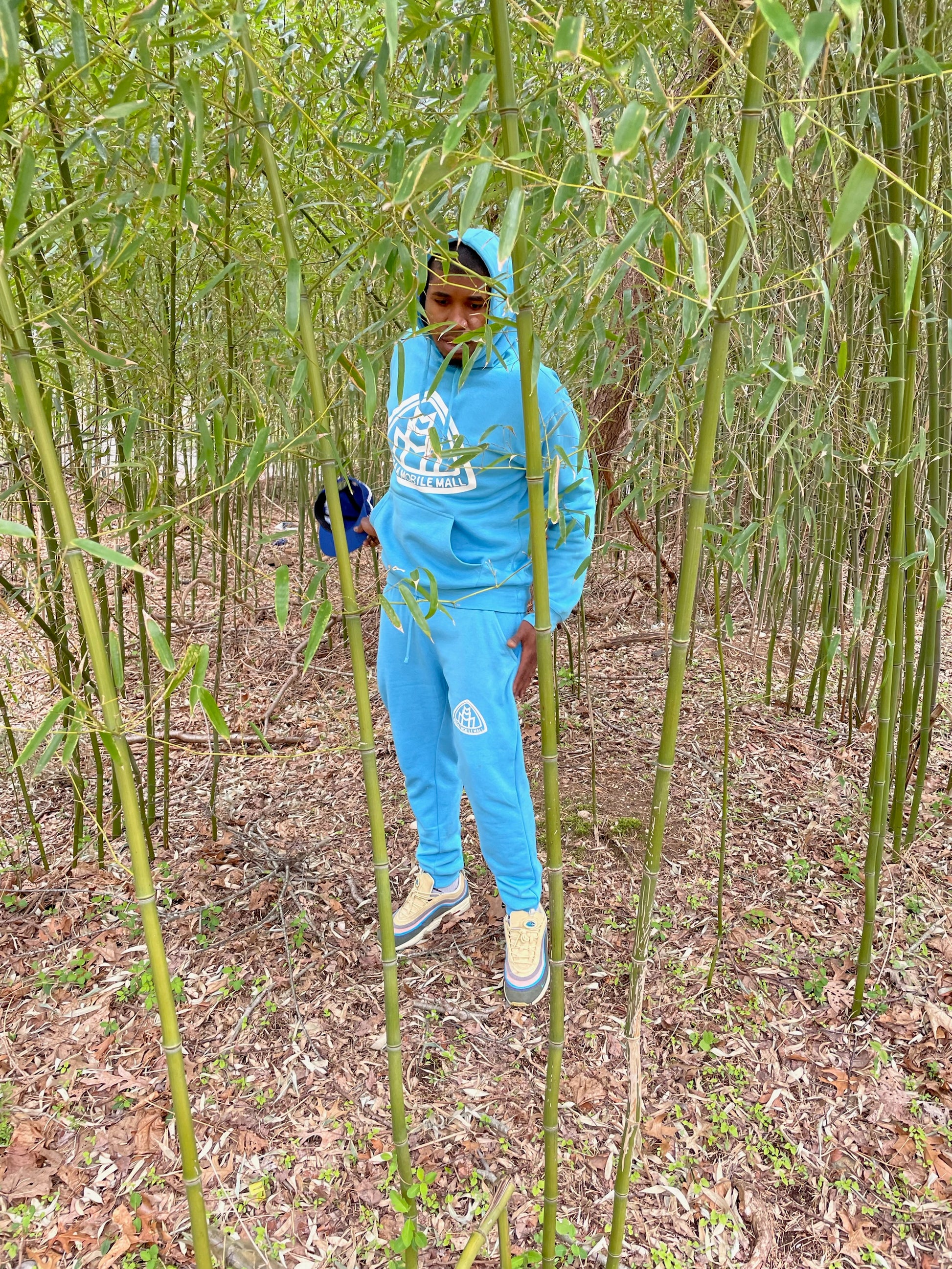sky blue MEGAAMOBILEMALL LOGO Heavy Blend Fleece Hooded SweatSuits white logo in bamboo gardens